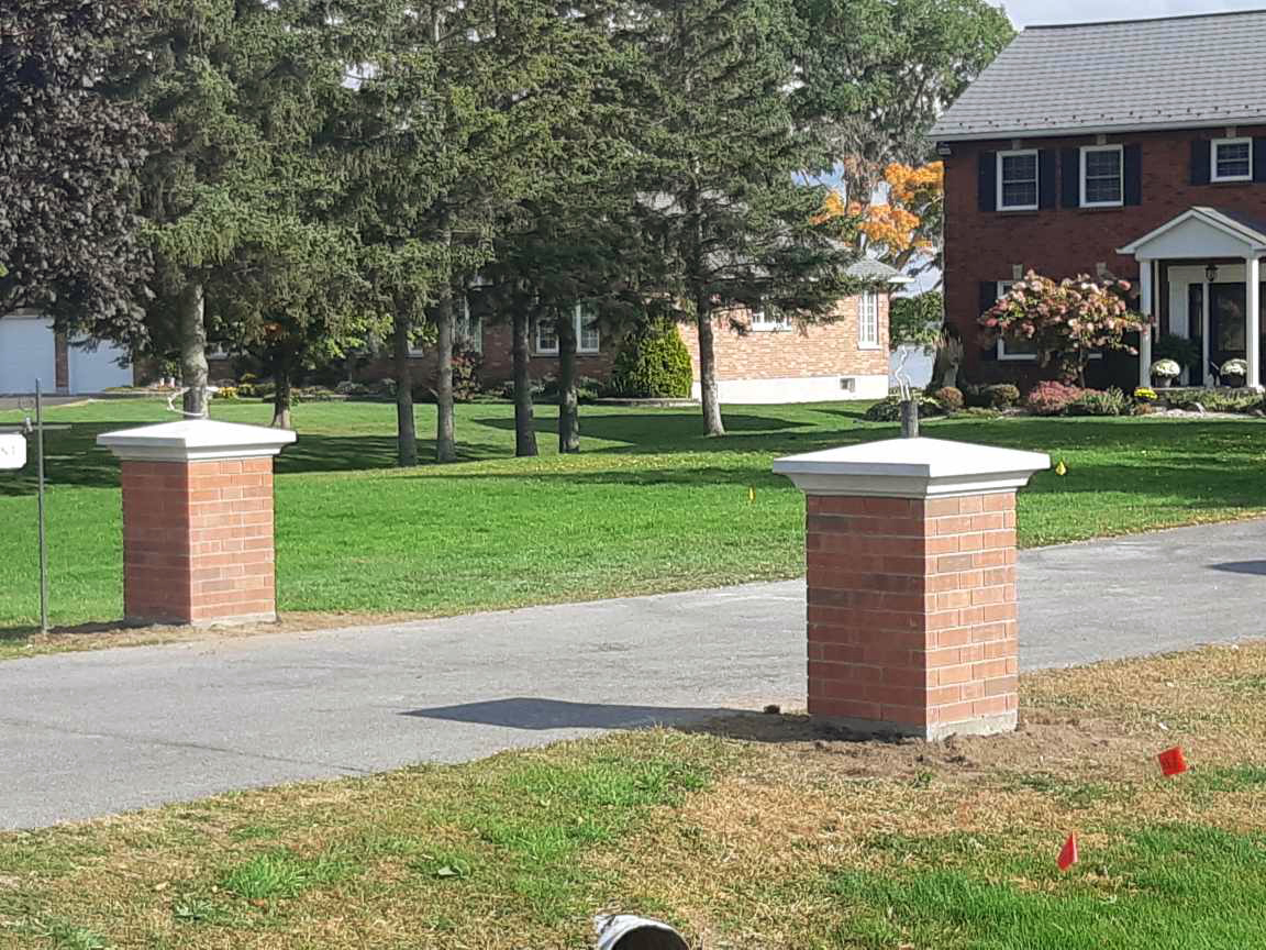 red brick driveway pillars