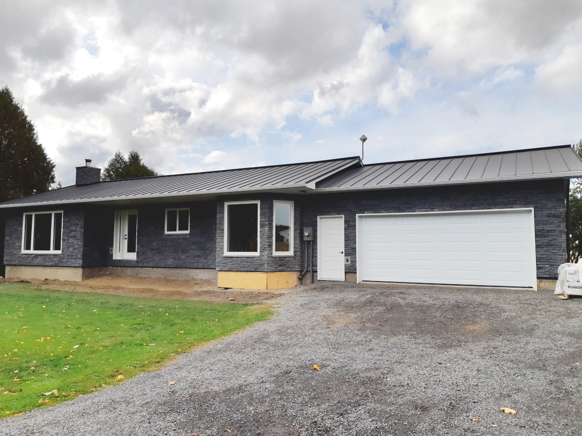 grey bungalow brick stone